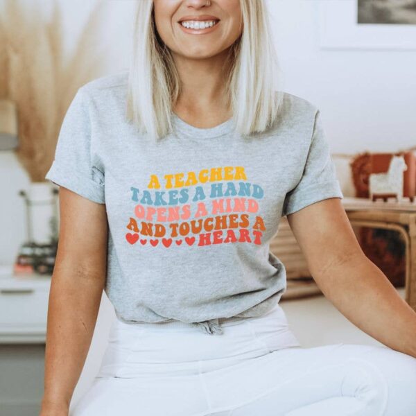 A Teacher Takes A Hand  T-shirt | Graphic Tee